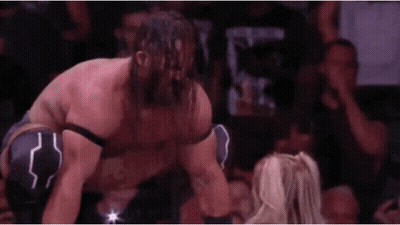 Bearded Wrestler Kneeling Next To Woman In Match GIF