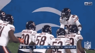 Bears Players Huddled On Field GIF