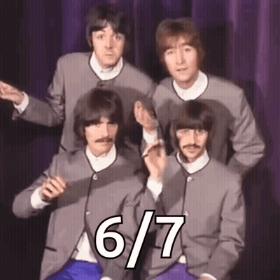 Beatles Posing In Suits Before Purple Curtain GIF