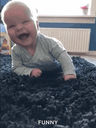 Beautiful Baby Rolling On The Floor Laughing GIF