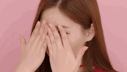 Beautiful Lady Peeking Behind Hands GIF