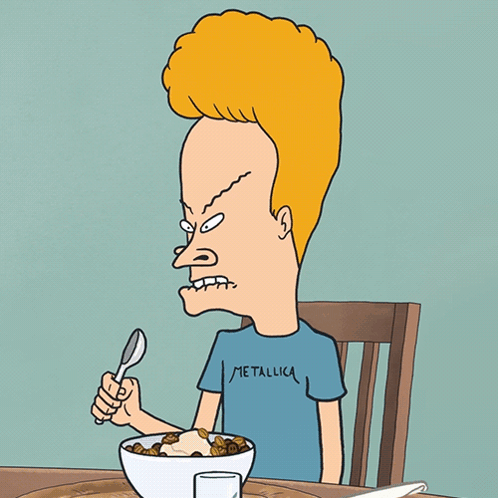 Beavis From Beavis And Butthead Is Sitting At A Table Eating Cereal GIF