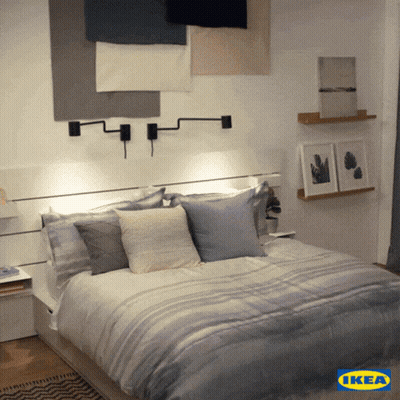 Bed In Bedroom With Blue IKEA Logo GIF