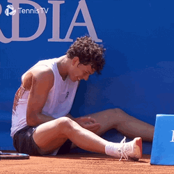 Ben Shelton Sitting On The Ground GIF