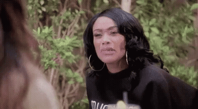 Benson And Dumwoody Sitting In Front Of A Chalkboard GIF