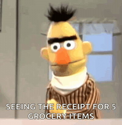 Bert From Sesame Street Is Looking At A Receipt For 5 Grocery Items GIF