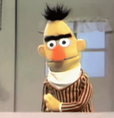 Bert From Sesame Street Is Wearing A Striped Shirt And Scarf GIF