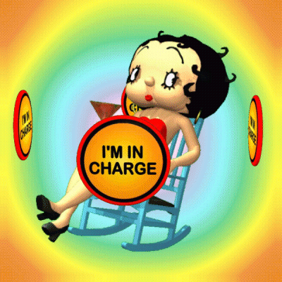 Betty Boop Is Sitting In A Rocking Chair With A Sign That Says " I 'M In Charge " GIF