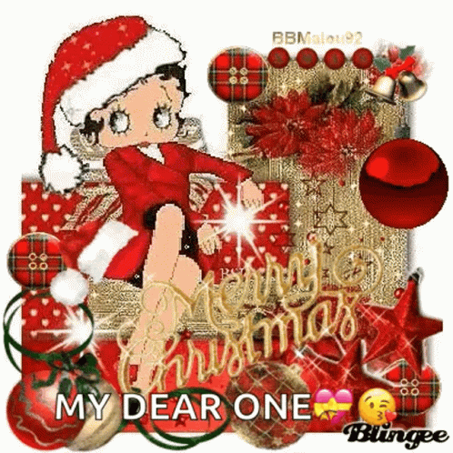 Betty Boop Is Wearing A Santa Hat And Sitting On A Christmas Tree . GIF