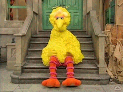 Big Bird From Sesame Street Sitting On Steps GIF