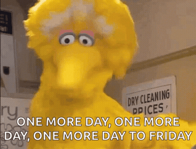 Big Bird Standing By Dry Cleaning Sign GIF