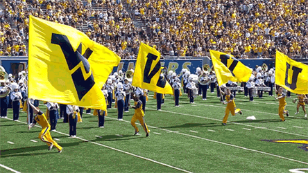 Big Flags Of Mountaineers Carried By Four Men GIF