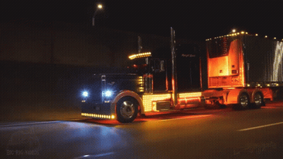 Big Rig Truck Driving Down Road At Night GIF