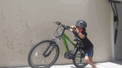 Bike Riding Kid Assisting The Bike GIF