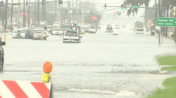 Biker Fall On The Flooding GIF