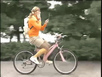Biking While Doing Some Make Up GIF