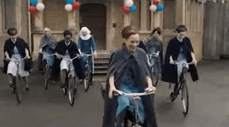 Biking Women In Festive Parade GIF