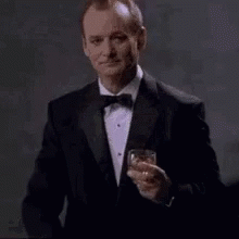 Bill Murray In Black Suit Holding A Glass Of Whiskey GIF