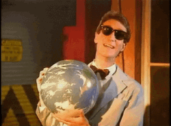 Bill Nye Head Shake While Holding Globe GIF