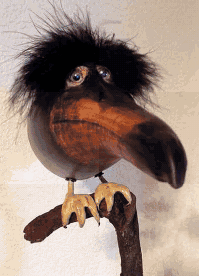 Bird Statue With Long Beak On Branch GIF