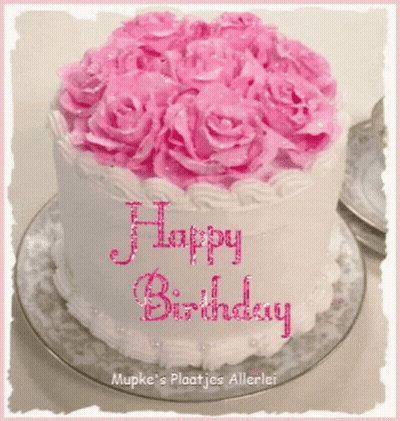 Birthday Cake With Candles And Confetti Saying Happy Birthday GIF