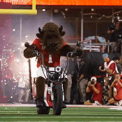 Bison Mascot Riding Motorcycle GIF