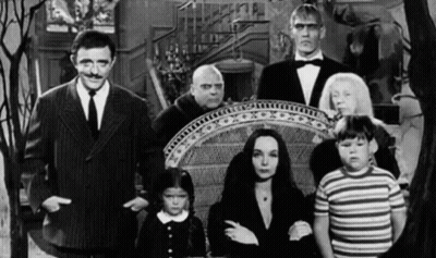Black And White Addams Family Standing Together GIF