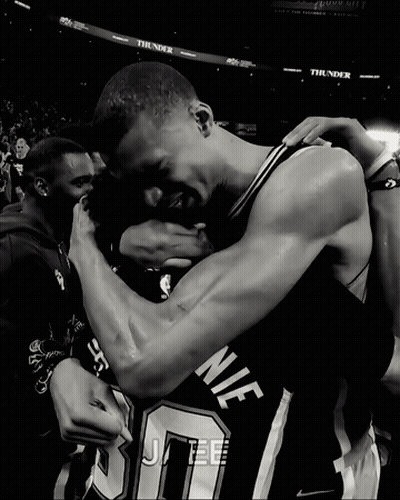 Black and White Basketball Players Hugging Number 10