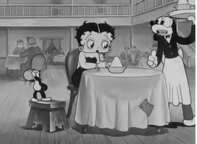 Black And White Betty Boop Sitting At Restaurant Table GIF
