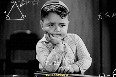 Black And White Boy At Chalkboard With Math Problems GIF