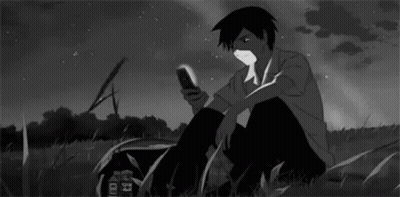 Black And White Boy Looking At Cell Phone GIF