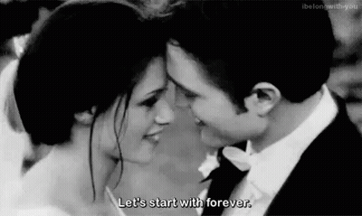 Black And White Bride And Groom Looking Into Each Others Eyes GIF