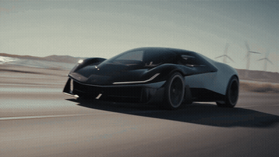 Black And White Car Driving Past Windmills GIF