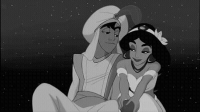 Black And White Cartoon Man And Woman Sitting GIF