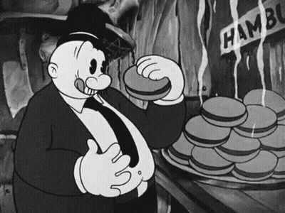 Black And White Cartoon Man Eating Hamburger Next To Pile GIF
