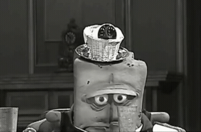 Black And White Cartoon With Basket On Head GIF