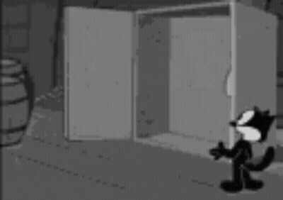 Black And White Cat Next To Safe With Ghosts GIF