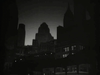 Black And White City At Night With Train GIF
