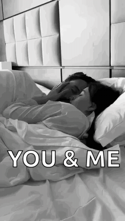 Black And White Couple Hugging In Bed GIF