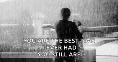 Black And White Couple Hugging In Rain With Quote GIF