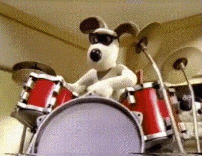 Black And White Dog Playing Drum GIF