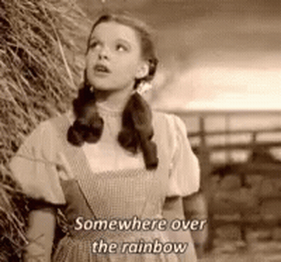 Black And White Girl Next To Hay Pile Somewhere Over The Rainbow GIF