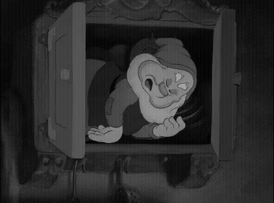 Black And White Gnome Looking Out Window GIF