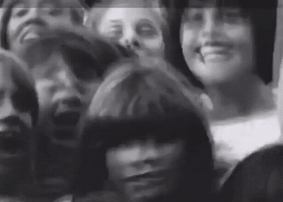 Black And White Group Sitting In Room GIF