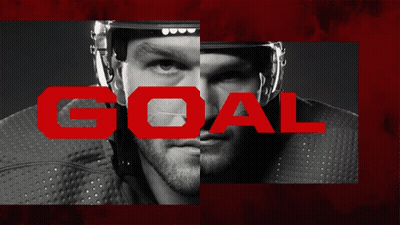 Black And White Hockey Player With Red Goal GIF