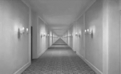 Black And White Hotel Hallway With Door GIF
