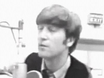 Black And White John Lennon Singing Into Microphone GIF