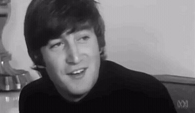 Black And White John Lennon Smiling And Talking GIF
