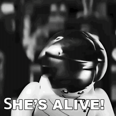Black And White Lego Figure Saying She's Alive GIF