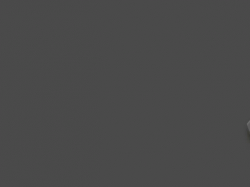 Black And White Logitech G304 Lightspeed Wireless Gaming Mouse On A Grey Background GIF